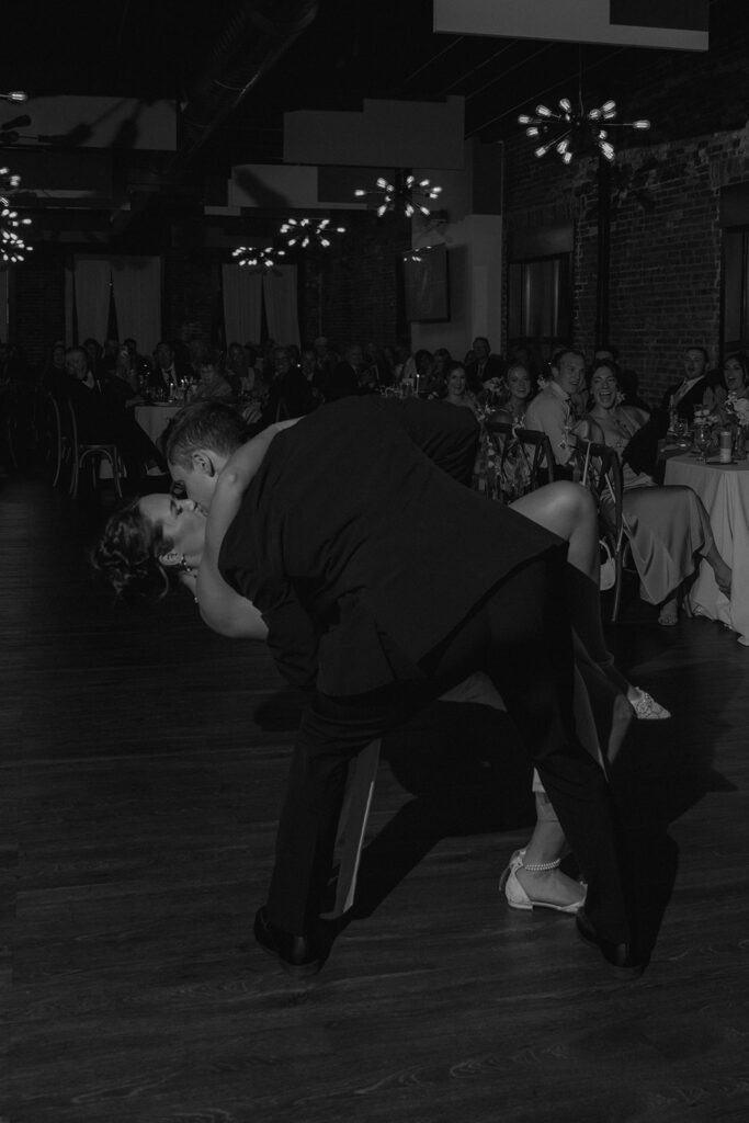 picture of the newly married couple kissing at their reception