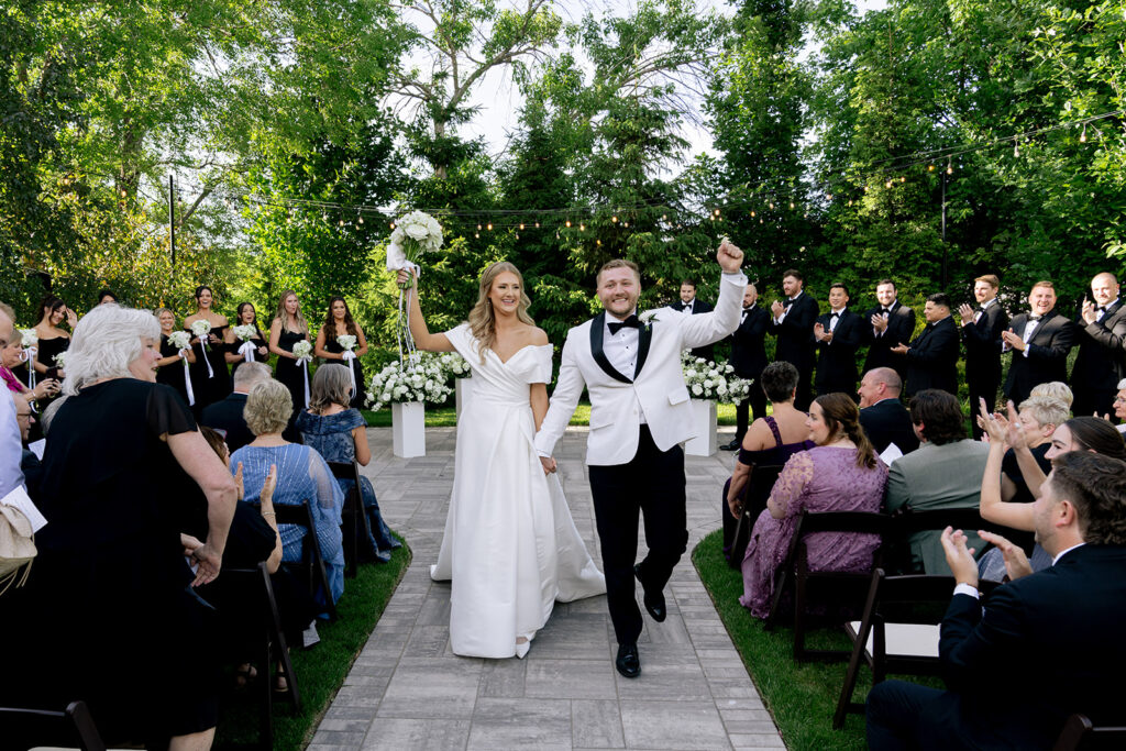 happy couple heading to their reception after their ceremony 