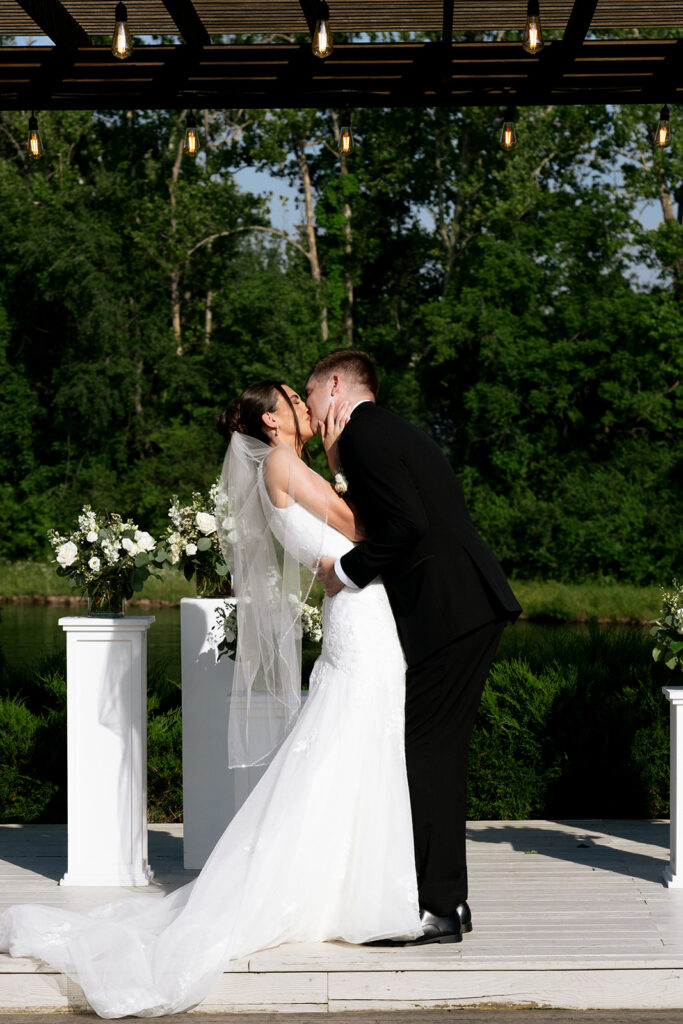couple kissing after their ceremony