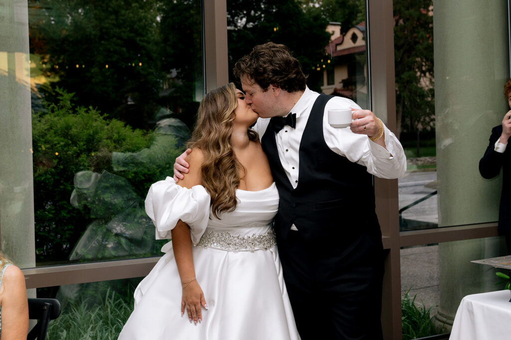 cute picture of the newlyweds kissing