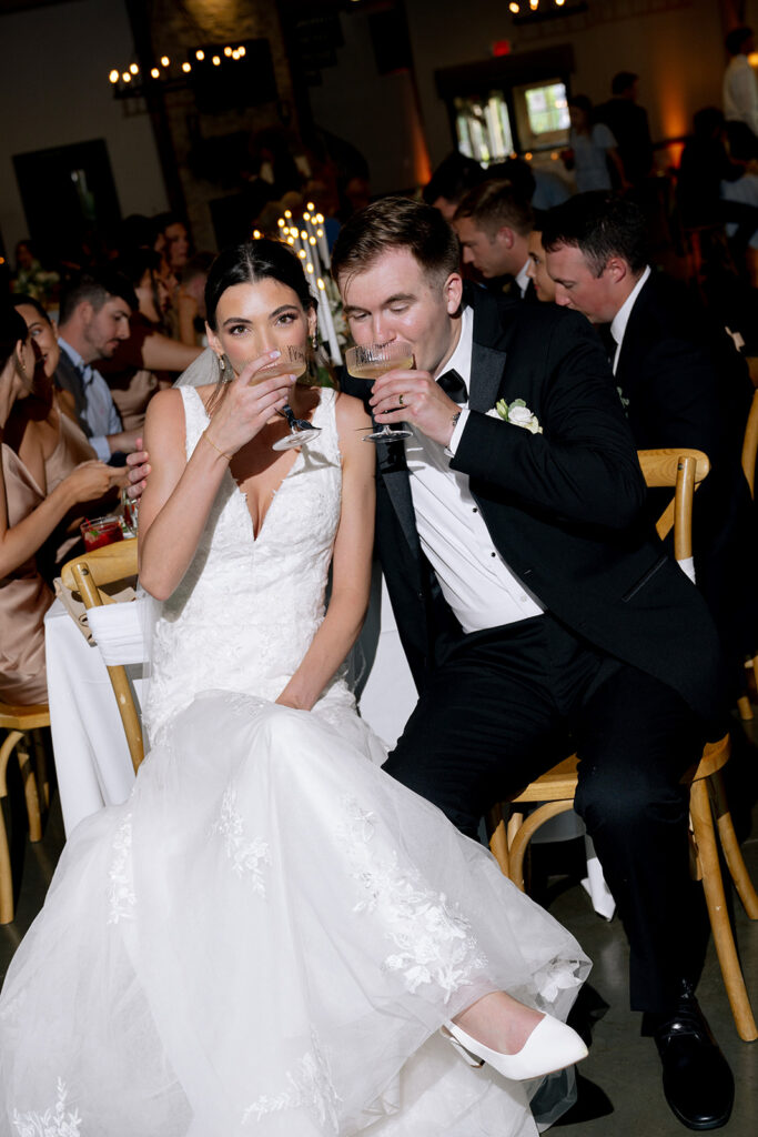 newlyweds celebrating their wedding with champagne