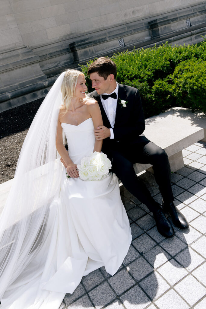 bride and groom laughing with each other during their bridal session