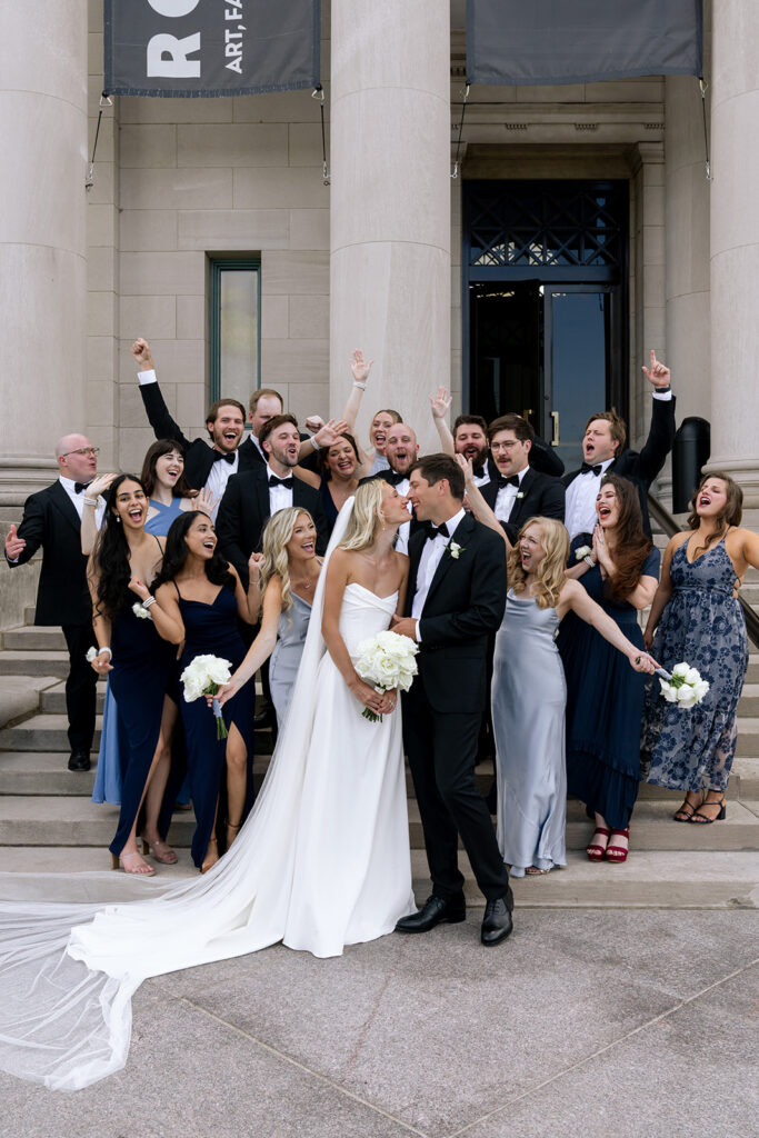 fun picture of the bride and groom with their bridal party