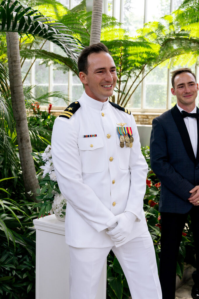 groom watching the bride walk down the aisle 