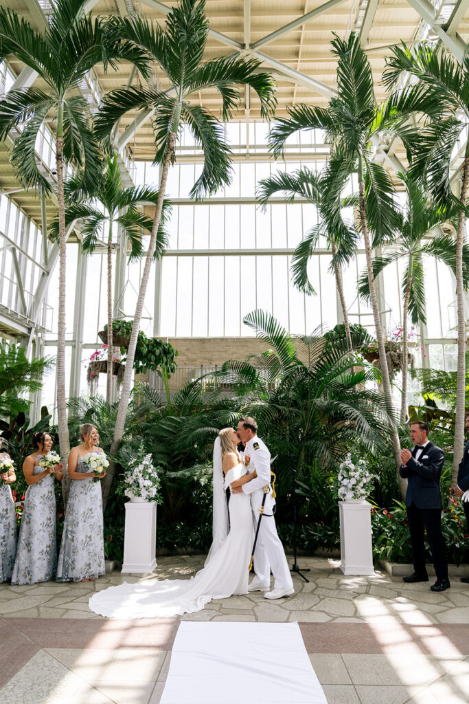 bride and groom kissing after their ceremony
