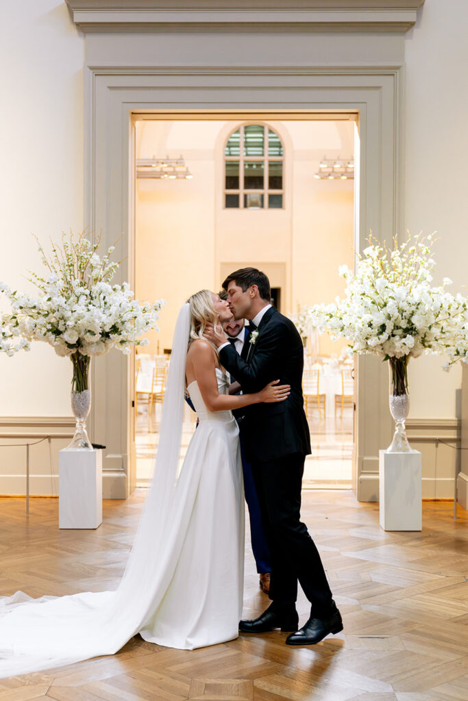 bride and groom kissing after their ceremony