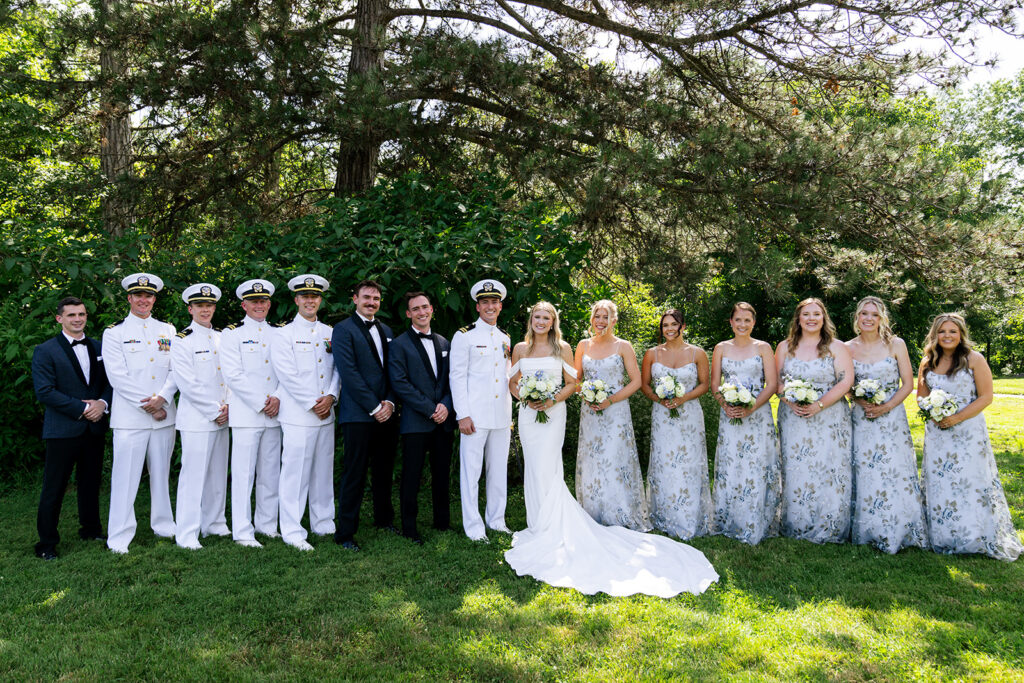 picture of the bride and groom with their bridesmaids and groomsmen 