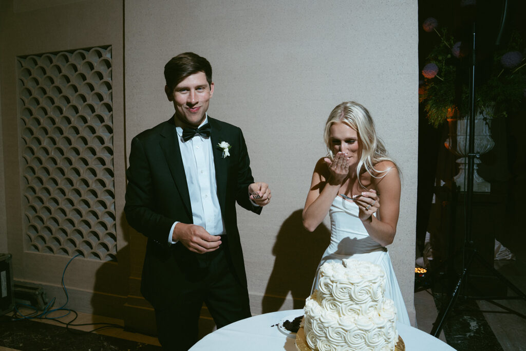 newlyweds cutting their wedding cake 