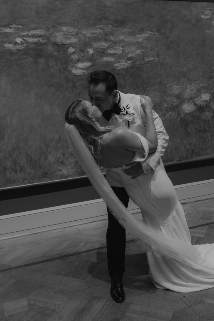 b&w picture of the newlyweds kissing