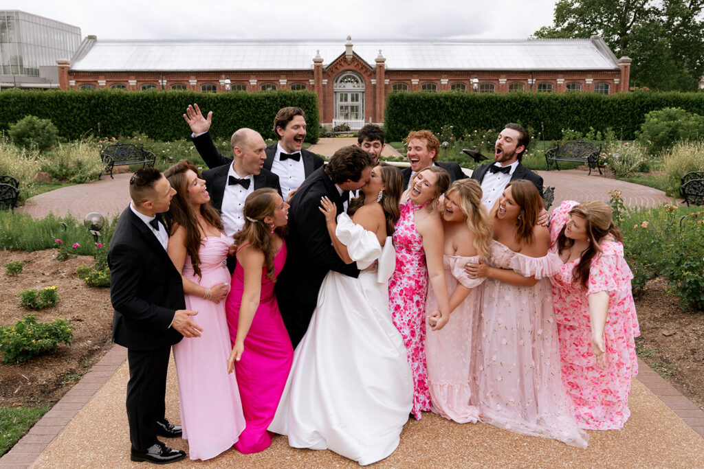 picture of the bride and groom with their bridesmaids and groomsmen 