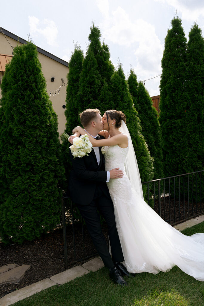 picture of the bride and groom kissing during their bridal portraits 