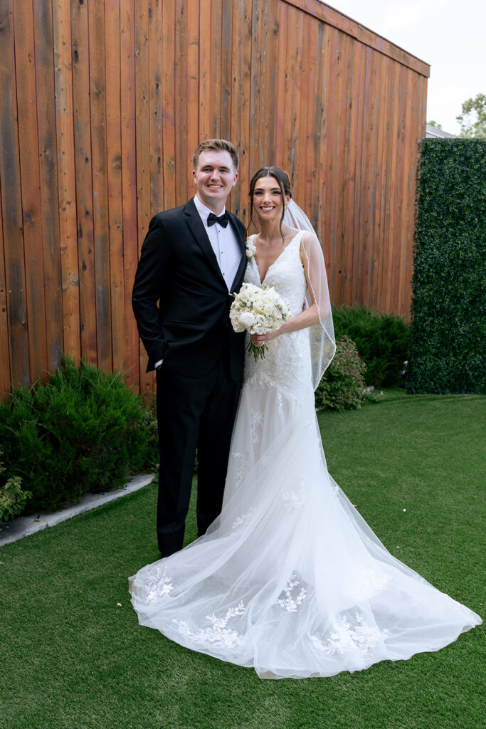bride and groom posing for the camera during their photoshoot