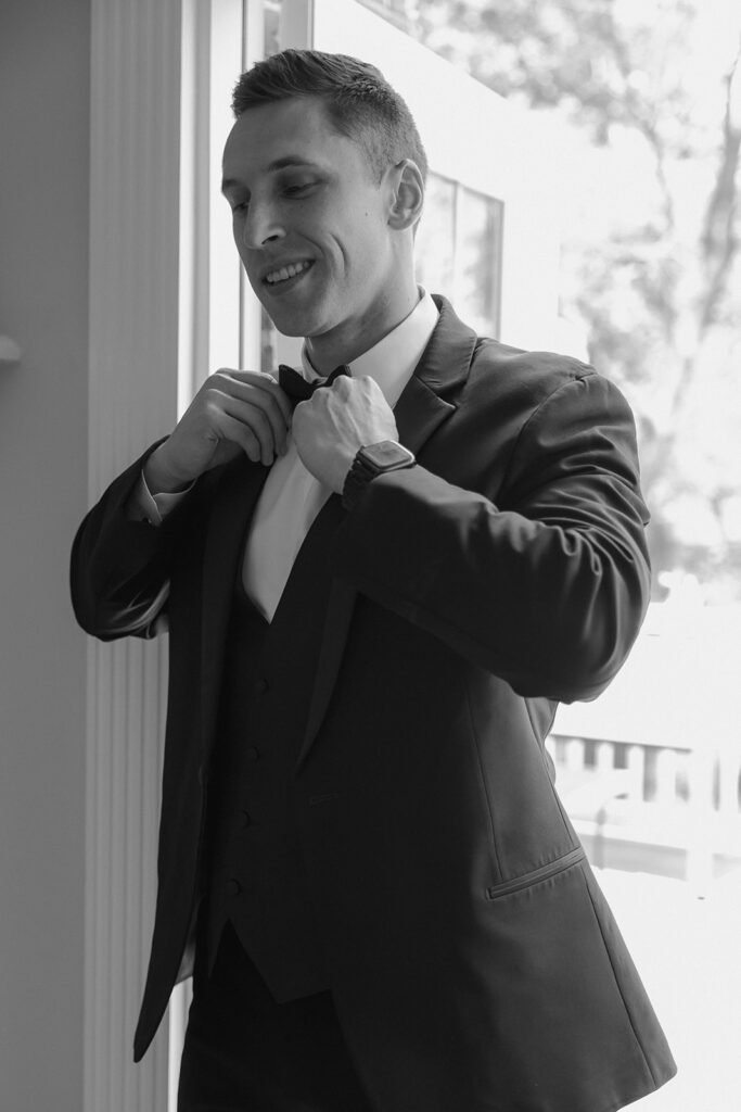 Groom, getting ready for his first look with the bride