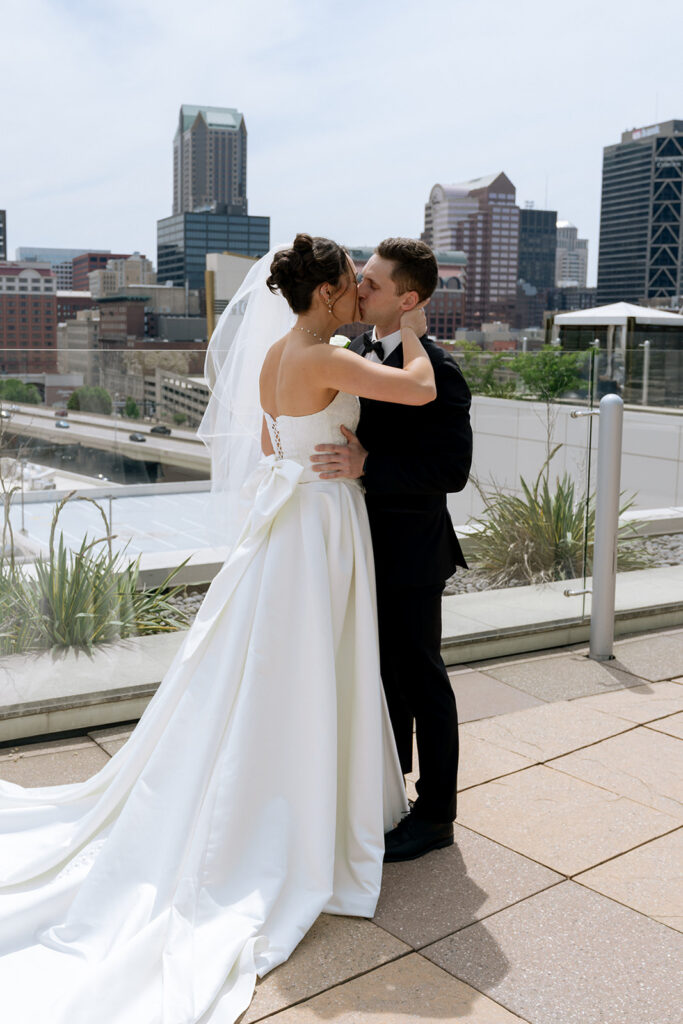 bride and groom kissing after their first look