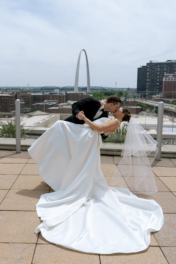 Couple smiling at the camera during their photoshoot