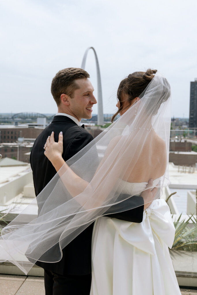 Picture of the bride and groom, smiling at each other
