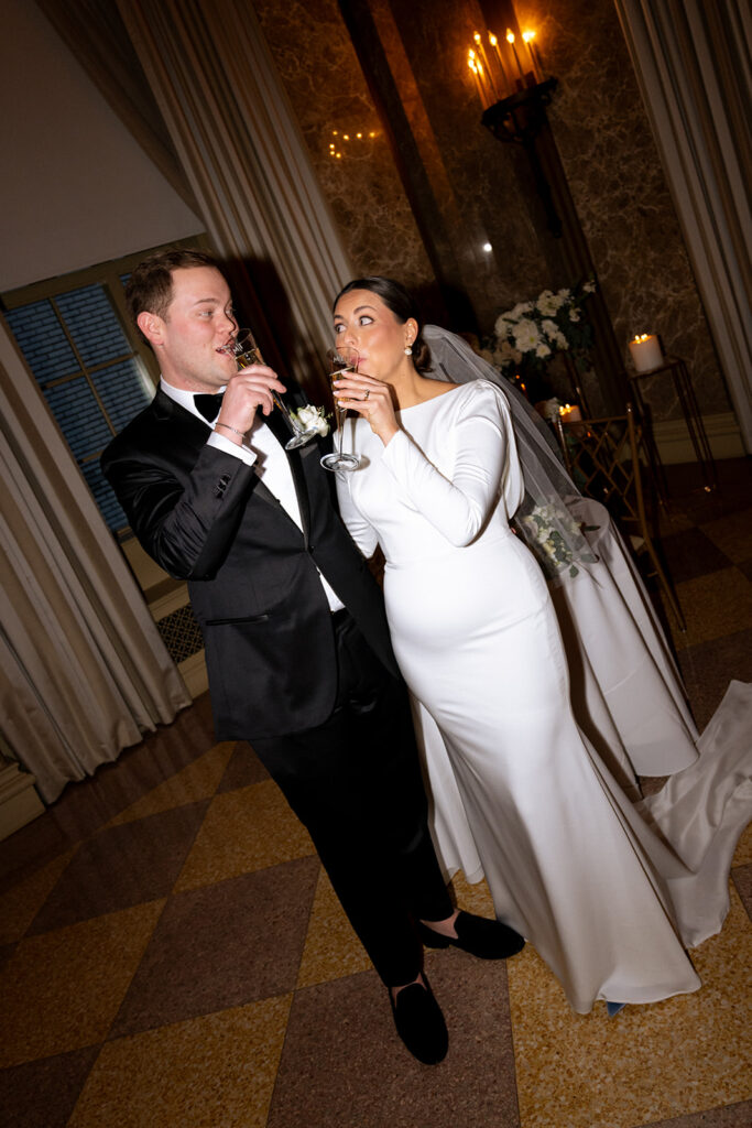 Cute picture of the newly married couple drinking champagne