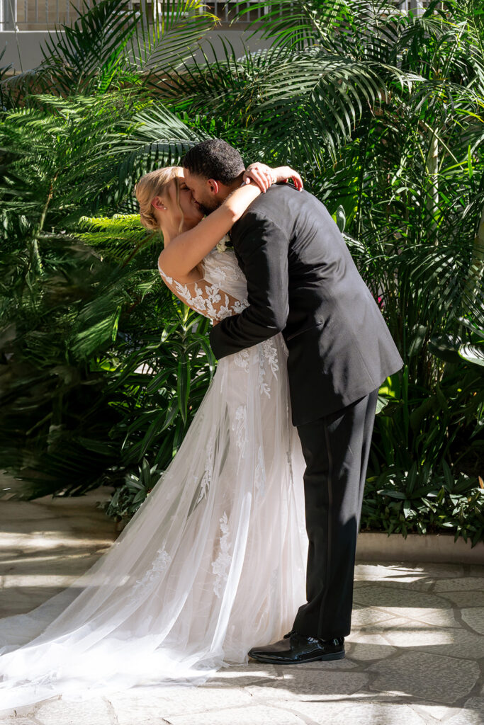 bride and groom kissing after their ceremony