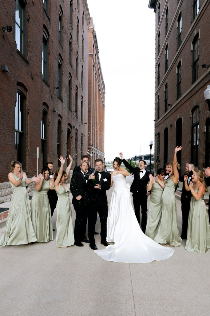 Bride and groom celebrating with champagne