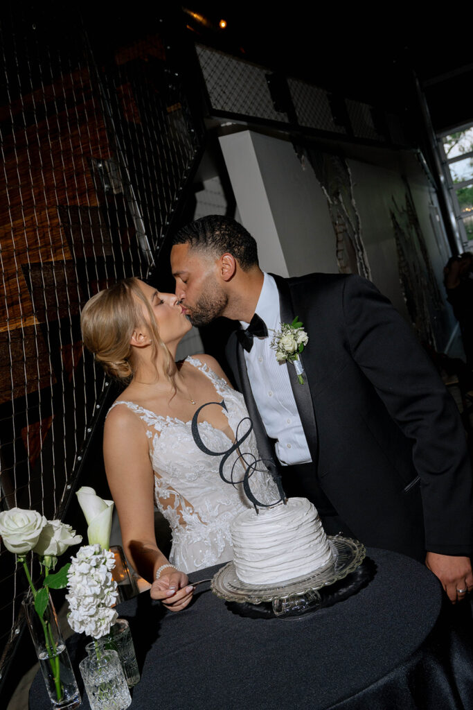 picture of the newlyweds kissing at their reception