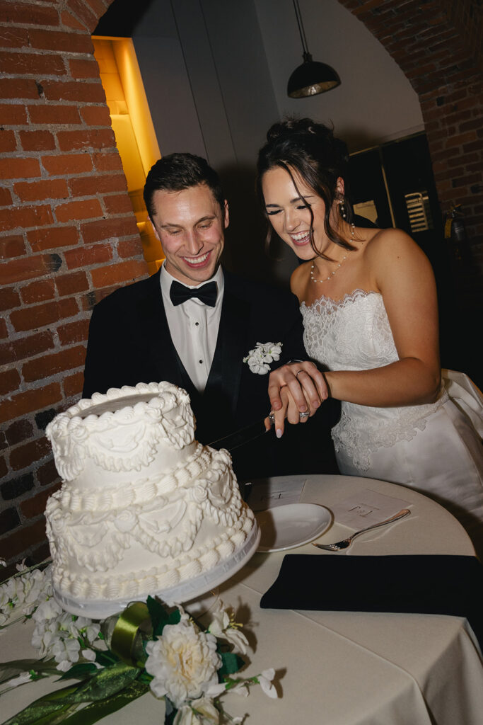 Picture of the newlyweds cutting their wedding cake