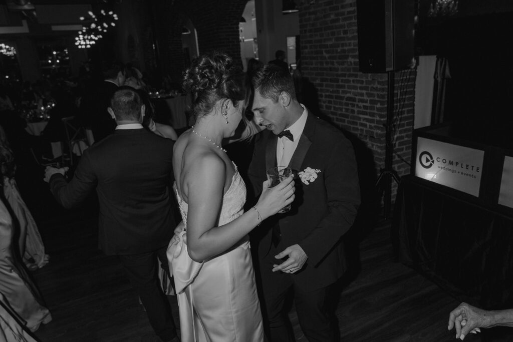 Newly married couple dancing at their wedding reception party