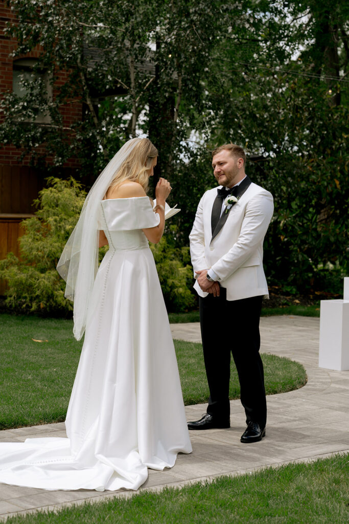 bride and groom emotional during their private vows