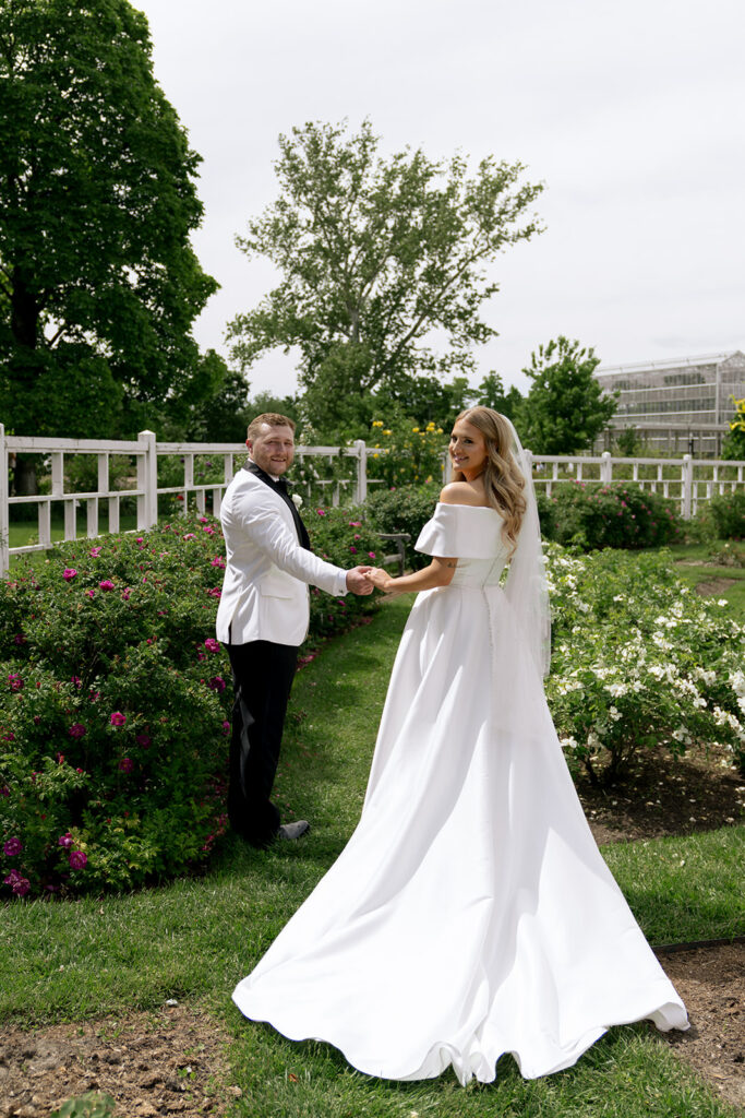 cute portrait of the bride and groom holding hands