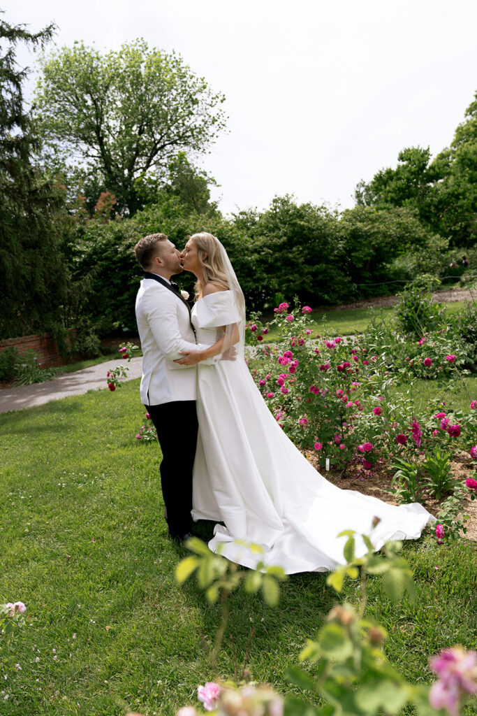 portraits of the bride and groom kissing