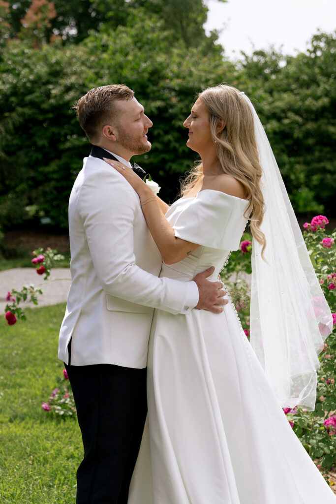 picture of the bride and groom smiling at each other