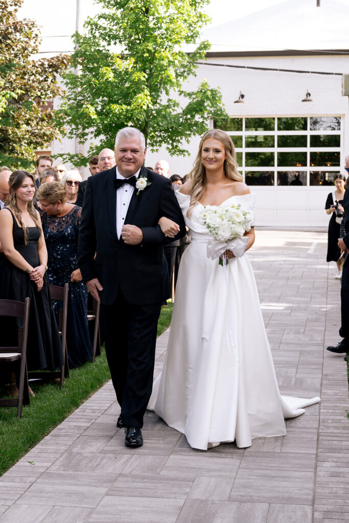 stunning picture of the bride walking down the aisle