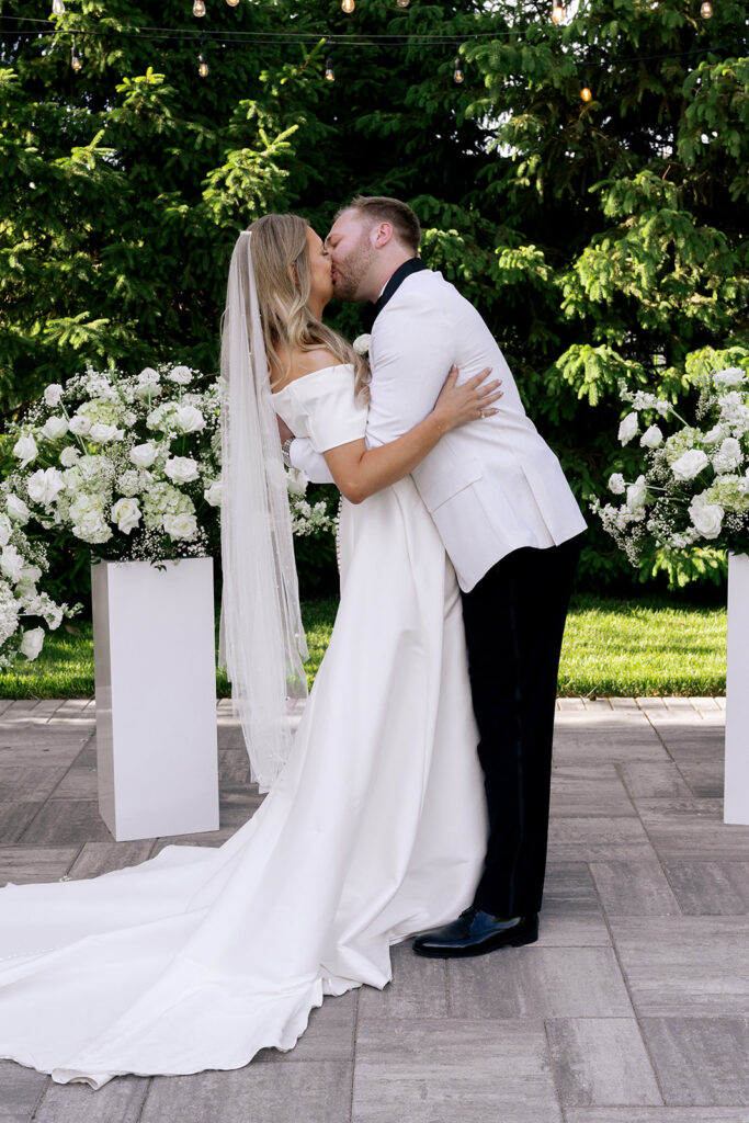 bride and groom kissing after their ceremony