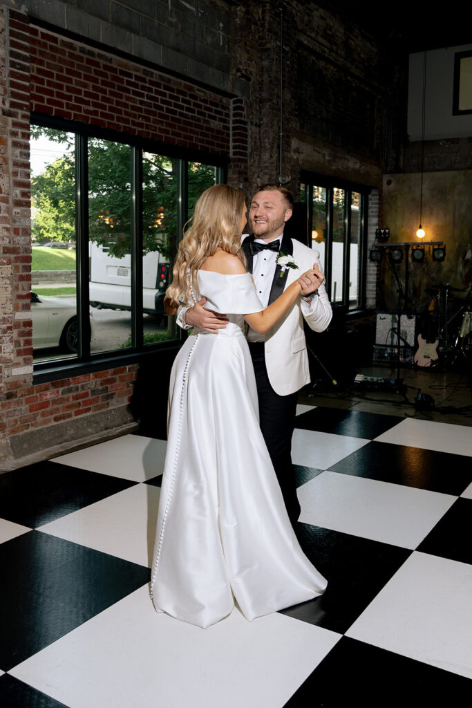 cute couple at their first dance at their reception party