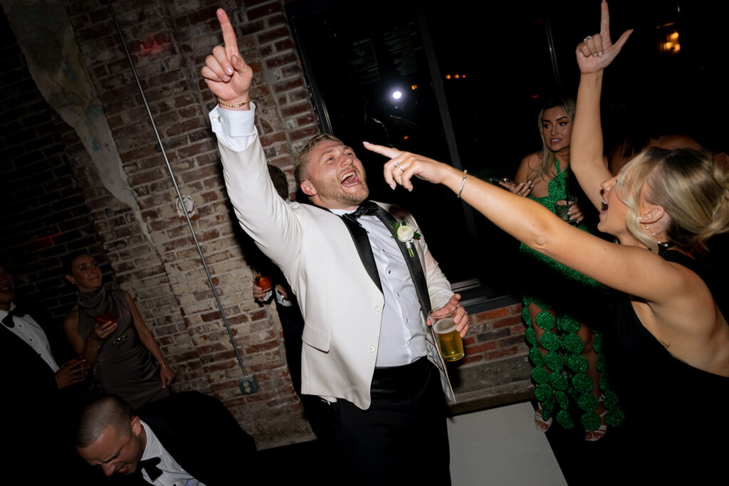 groom dancing at his reception party