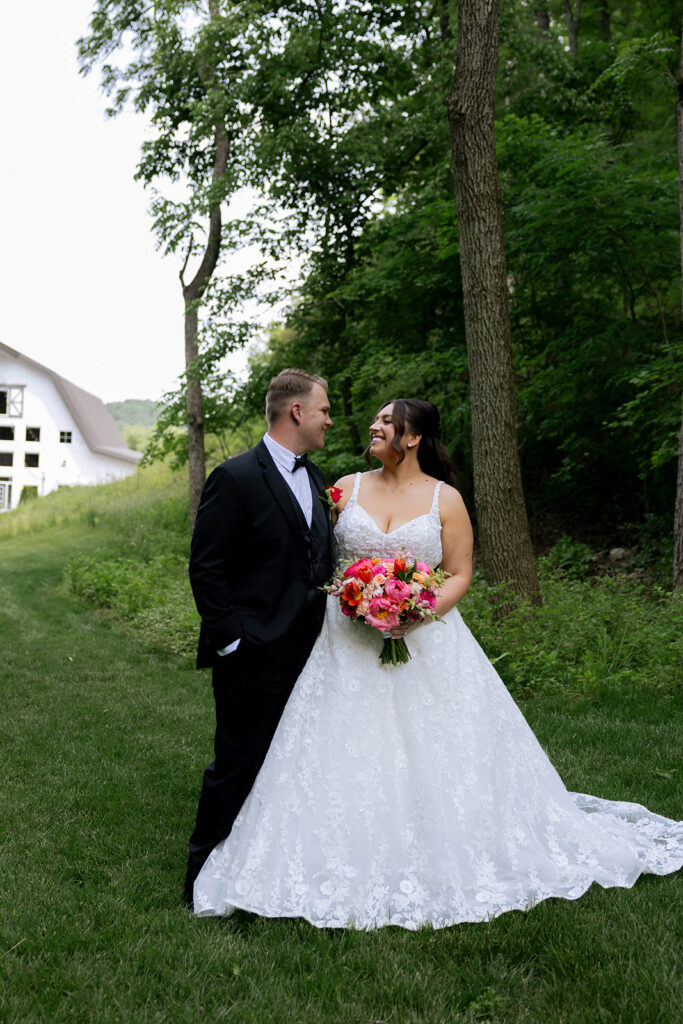 bride and groom laughing with each other during their bridal session