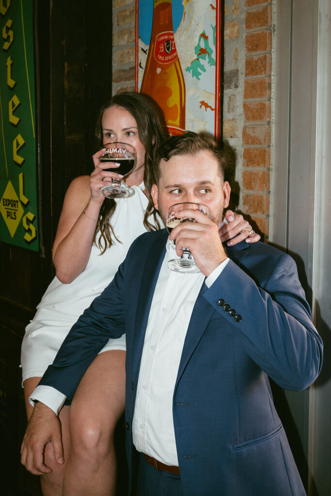 Couple celebrating their engagement with a drink