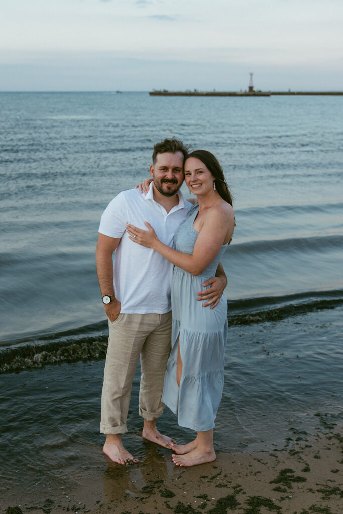 Couple smiling at the camera during their photo session