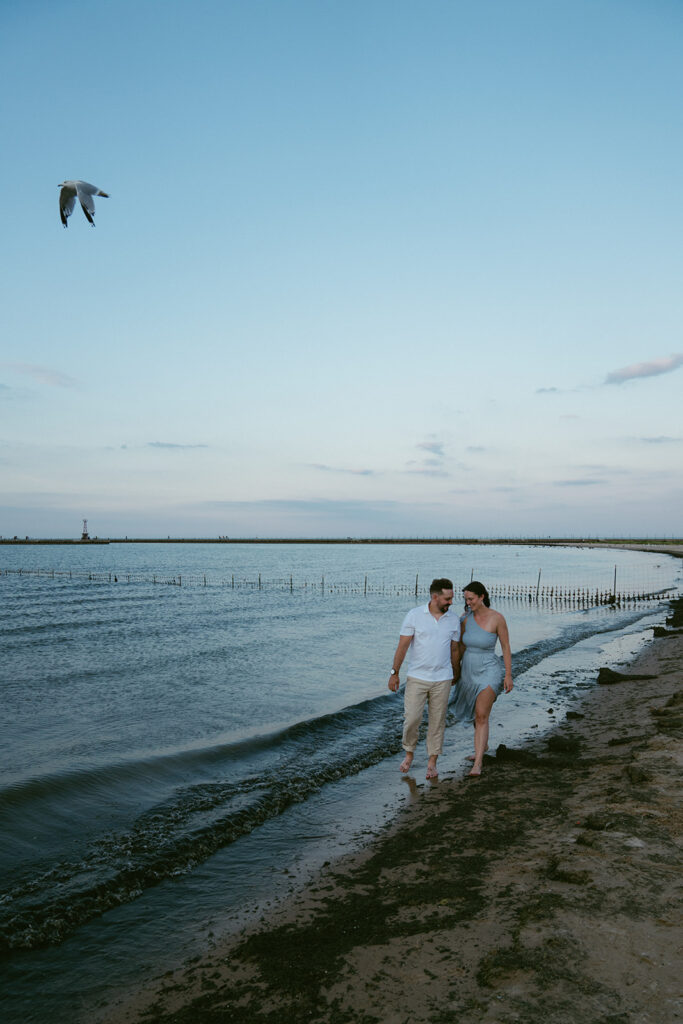 newly engaged couple at the beach 