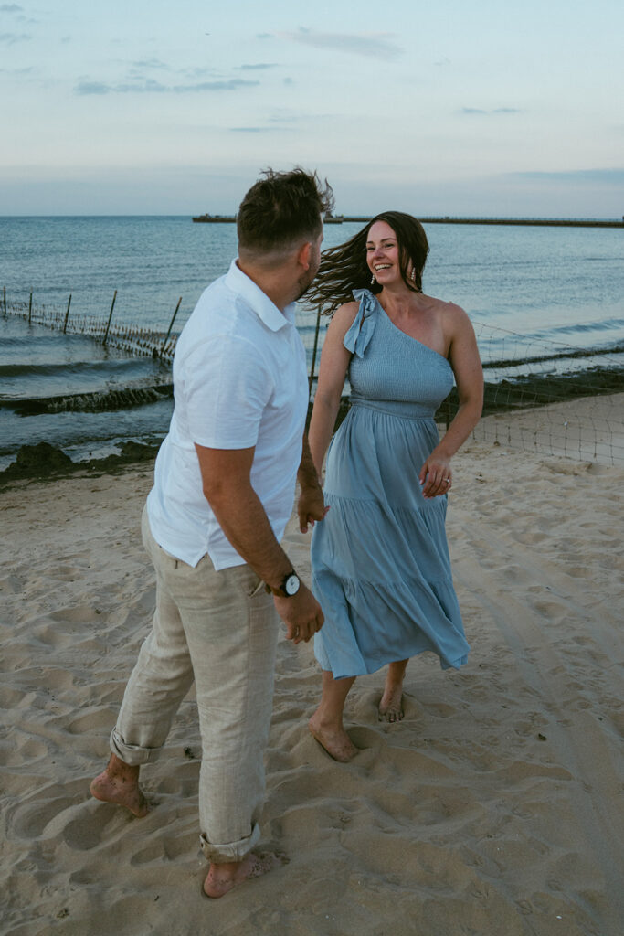 Newly engaged couple dancing during their photo session