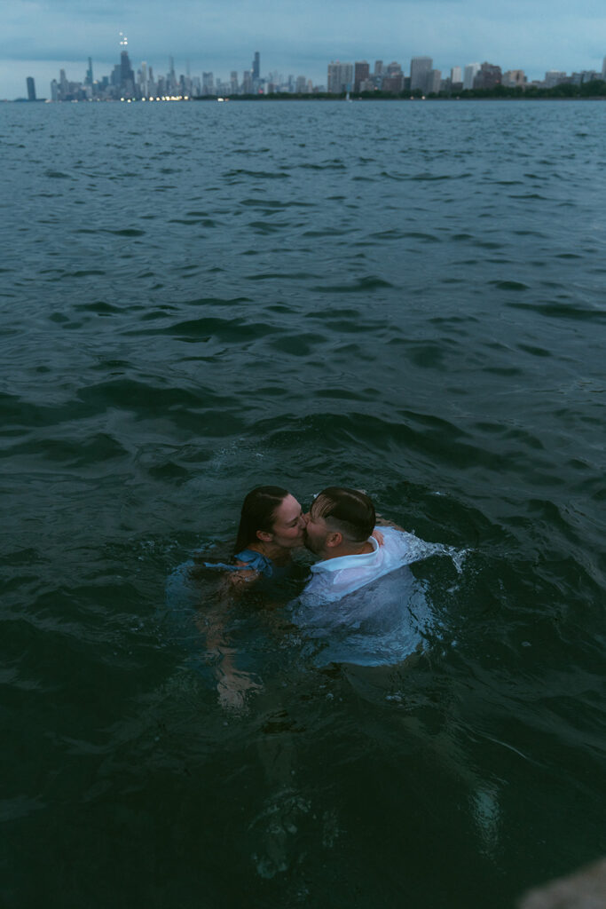 picture of the newly engaged couple kissing