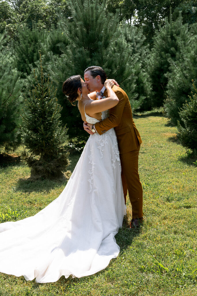 bride and groom kissing after their first look