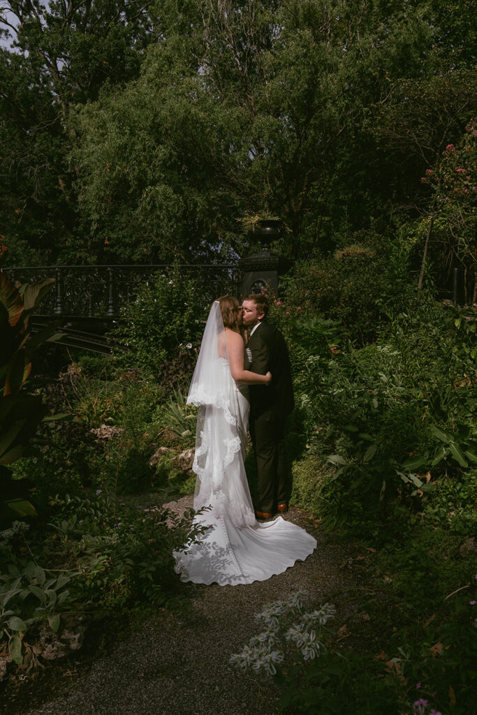 cute picture of the groom kissing the bride on the cheek
