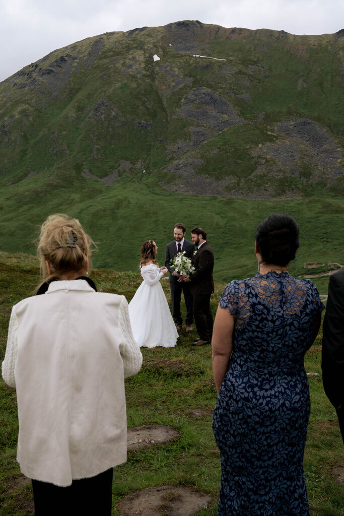 Bride and groom holding hands during their wedding ceremony