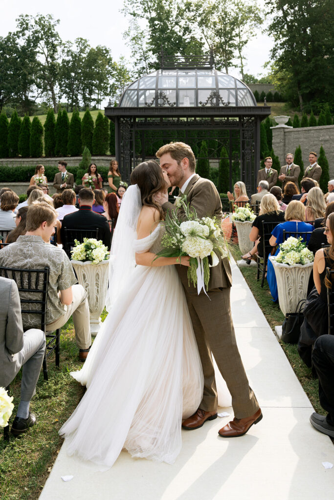 Couple kissing after their ceremony