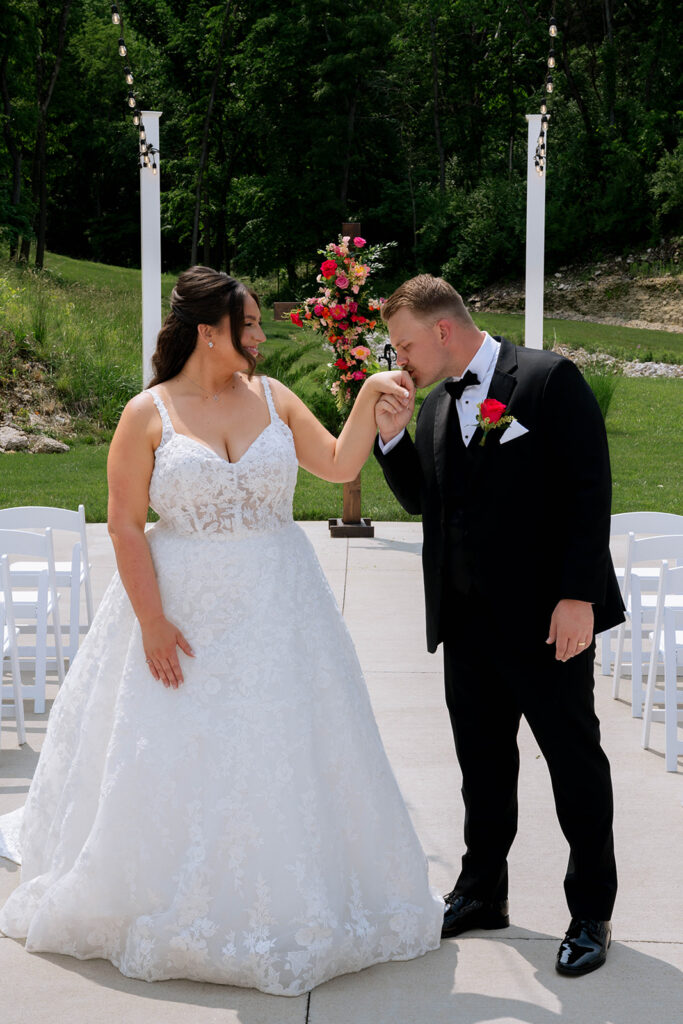 picture of the groom holding the brides hand