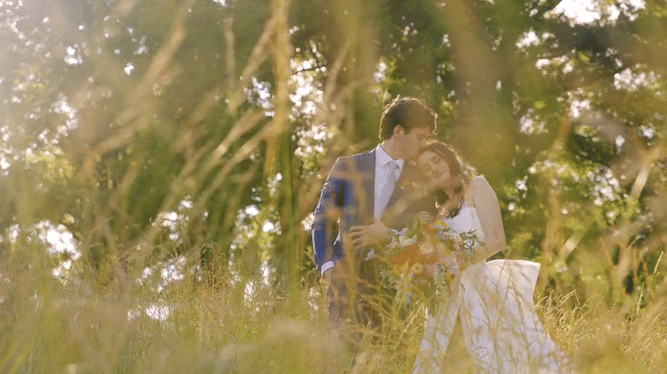 groom kissing the bride on the forehead