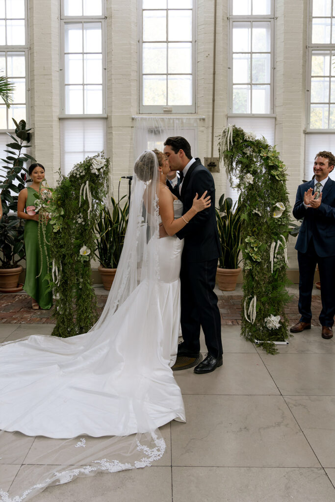 cute picture of the bride and groom kissing