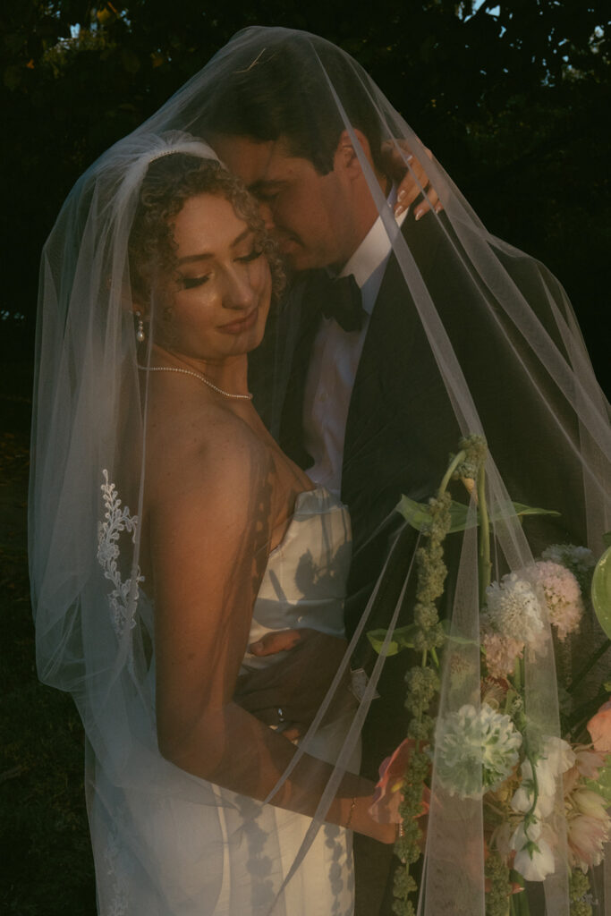groom kissing the bride on the cheek