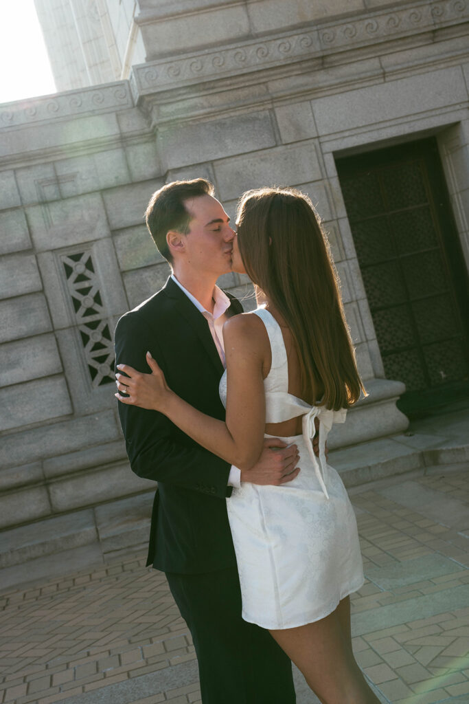 cute picture of the newly engaged couple kissing