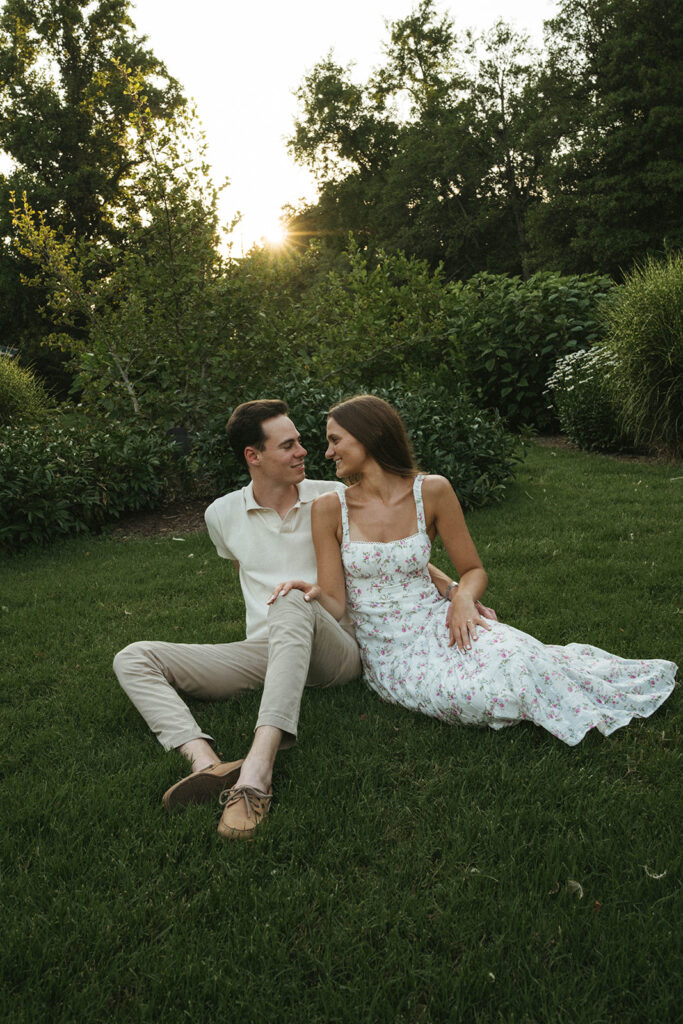 cute couple laughing with each other during their session